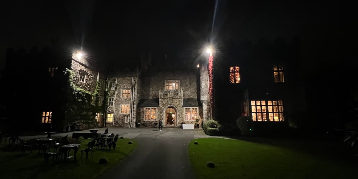 The outside of a castle at night.